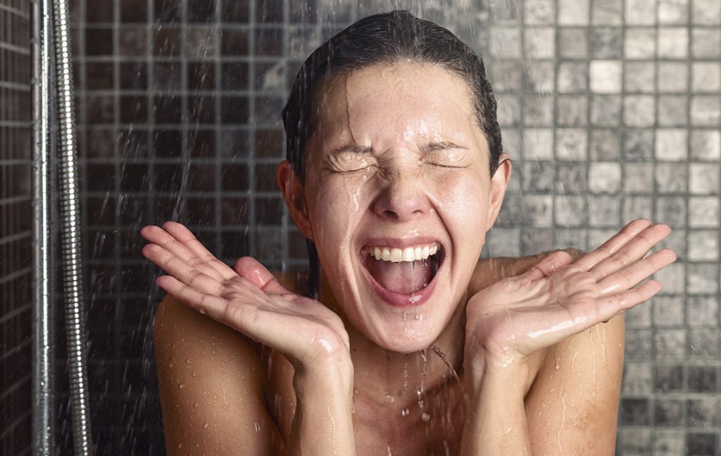 woman taking a cold shower
