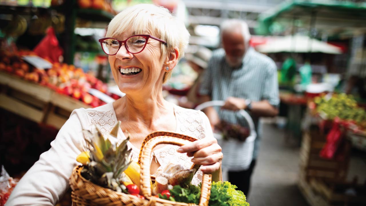 woman carrying groceries full of nutrients like Niacin