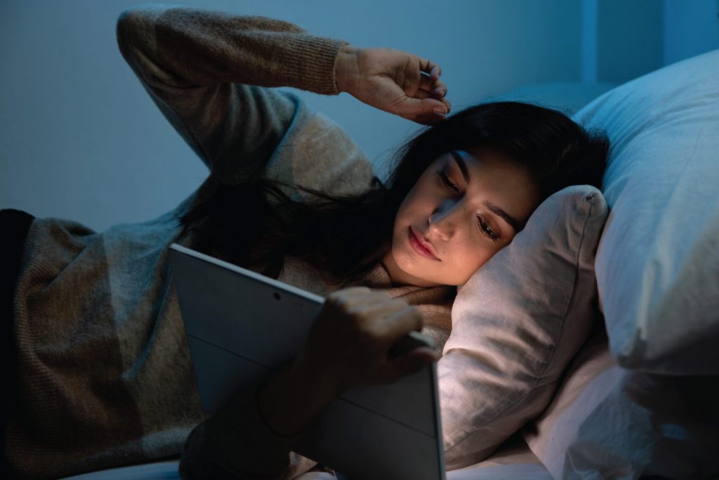 woman looking at blue light